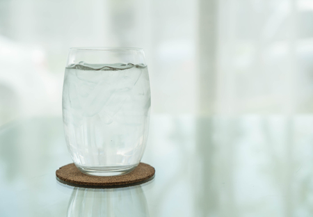 glass of water on dinning tableの写真素材