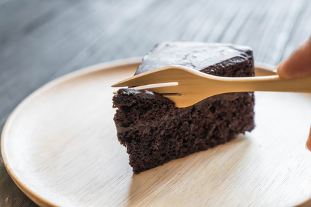 chocolate soft cake on wood plateの写真素材