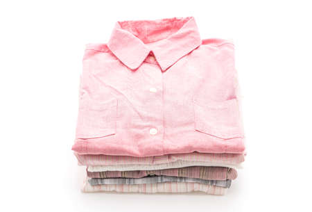 stacks of clothing on white background