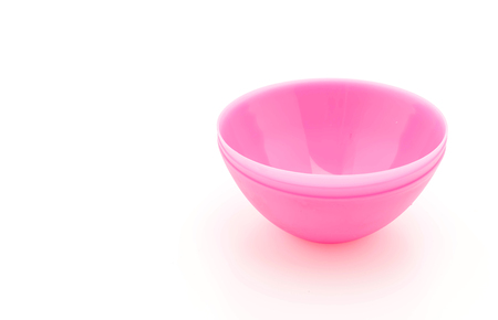 pink plastic bowl on white backgroundの写真素材