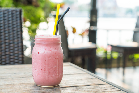jar of strawberry smoothie in cafeの写真素材