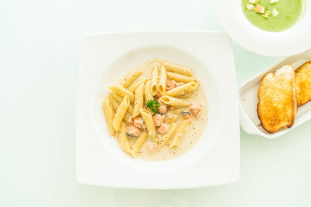 Penne carbonara pasta with salmon - Italian food styleの写真素材
