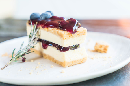blueberry cheese cake on white plateの写真素材