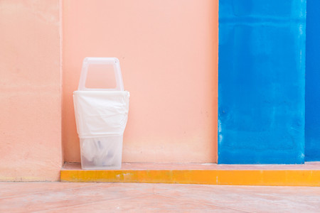 recycle bin on pink wall with copy spaceの写真素材