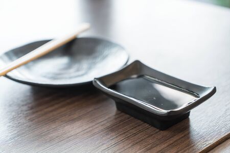 empty black plate in restaurantの写真素材