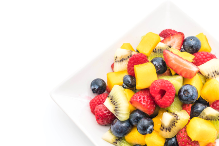 mixed fresh fruits (strawberry, raspberry, blueberry, kiwi, mango) on white backgroundの写真素材