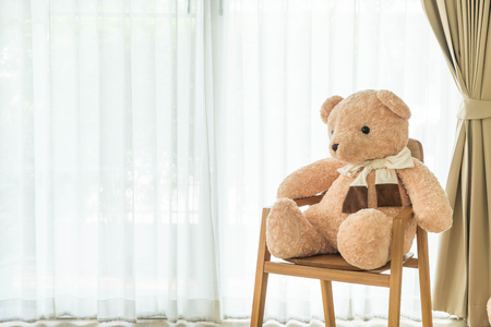 bear doll on chair decoration at homeの写真素材