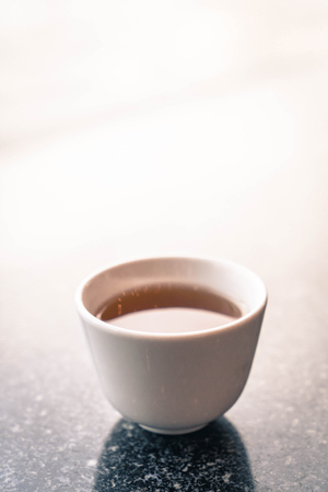 selective focus point -chinese tea cup - vintage filter effectの写真素材