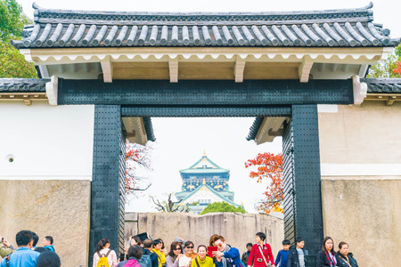 OSAKA, JAPAN - NOV 20 : Visitors crowded at Osaka Castle Park. It is a public urban park and historical site situated at Osaka, Japan.のeditorial素材
