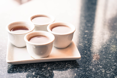 selective focus point -chinese tea cup - vintage filter effectの写真素材