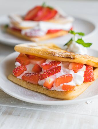 waffle with strawberry on wood tableの写真素材