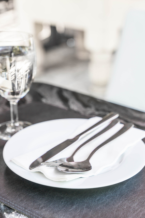 empty plate on dinning table with glassの写真素材