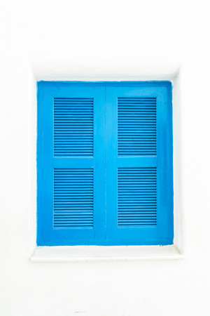 blue window with white wall - vintage lighting styleの写真素材