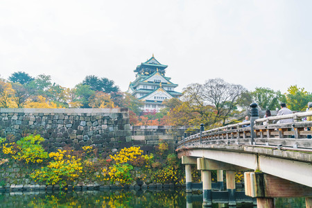 OSAKA, JAPAN - NOV 20 : Visitors crowded at Osaka Castle Park. It is a public urban park and historical site situated at Osaka, Japan.のeditorial素材