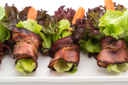 salad roll with bacon on white backgroundの写真素材