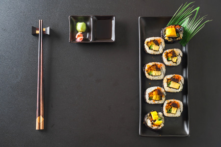 sushi roll on black plate - japanese food styleの写真素材