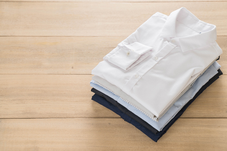 shirt fold stack on wood backgroundの写真素材
