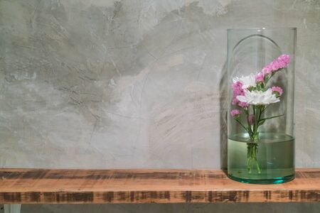 flowers in vase  decoration on wood shelfの写真素材