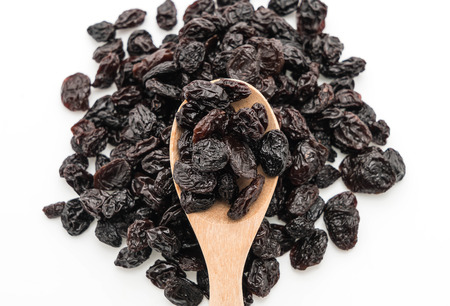 black raisins on white backgroundの写真素材