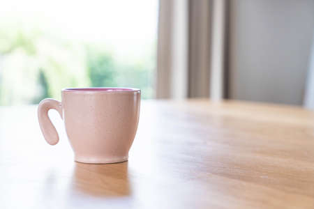 coffee cup on wood tableの写真素材