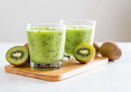 Healthy fresh kiwi smoothie in glass - selective focus pointの写真素材