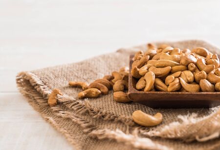 Roasted cashew nuts in bowlの写真素材