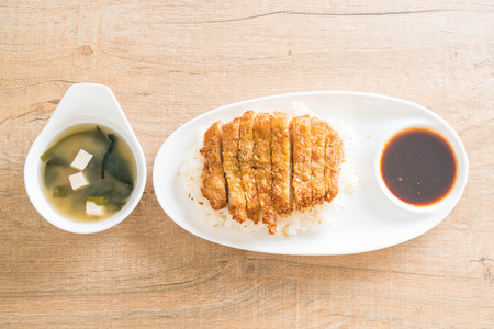 fried pork on topped rice (tonkatsu) with miso soup - japanese food styleの写真素材