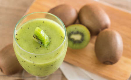 Healthy fresh kiwi smoothie in glass - selective focus pointの写真素材