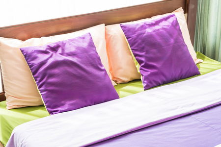 Beautiful pillow on bed interior decorationの写真素材