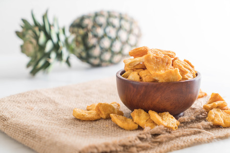 dried pineapple crispy chips in bowlの写真素材