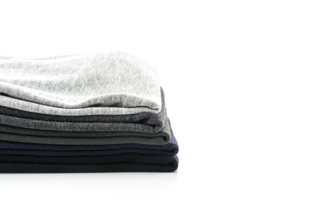 Stack of clothes on white backgroundの写真素材