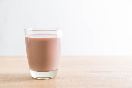 glass of chocolate milk on the tableの写真素材