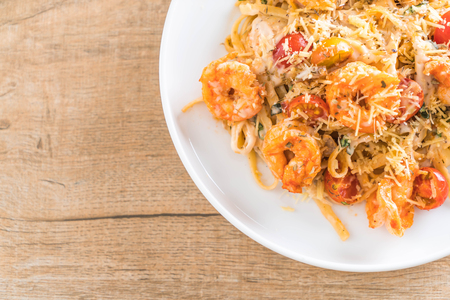 delicious spaghetti with shrimps, tomatoes, basil and cheese - italian food styleの写真素材