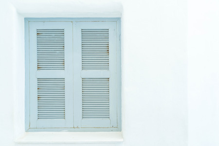 gray window with white wall - vintage lighting styleの写真素材