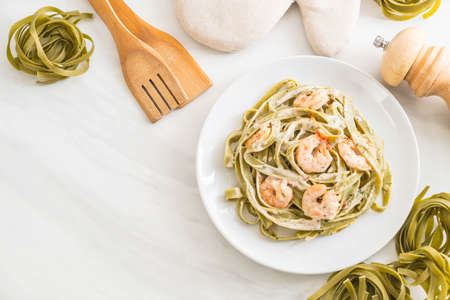 spinach fettuccini pasta with shrimp - Italian food styleの写真素材