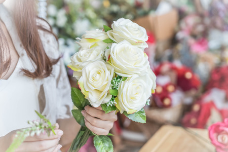 Hands holding bouquet of flower - vintage lighting styleの写真素材