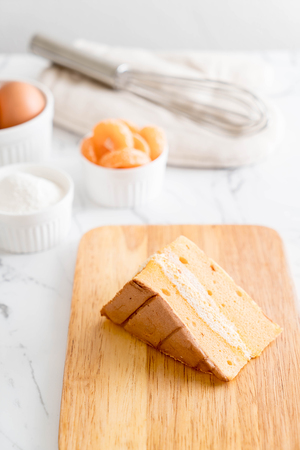orange chiffon cake on tableの写真素材