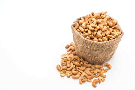 Roasted cashew nuts isolated on white backgroundの写真素材