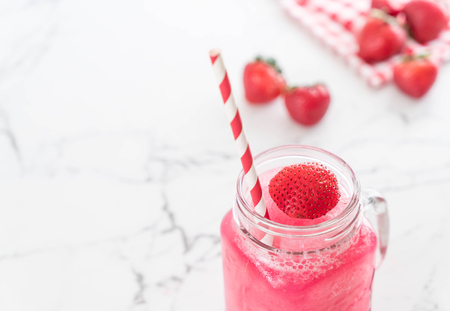 fresh strawberry smoothie on the tableの写真素材