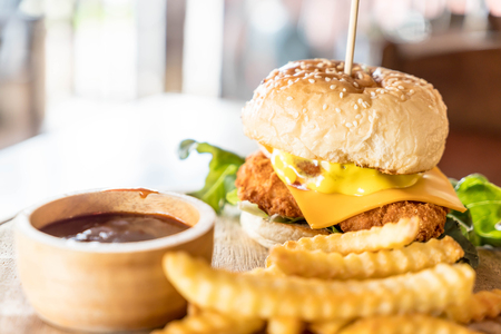 fried chicken and cheese burger with french friesの写真素材