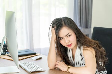 seriously asian woman in office - business conceptの写真素材