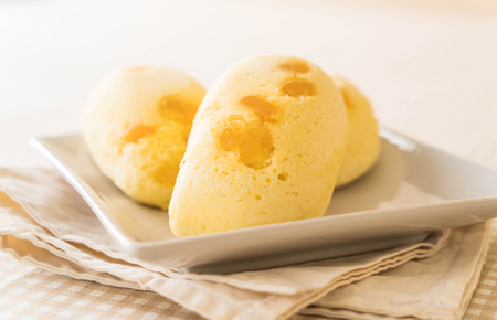 mango soft cake on wood backgroundの写真素材