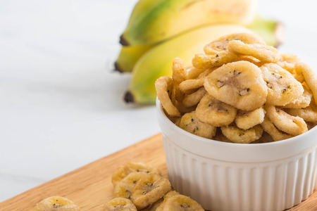 banana crispy chips in bowlの写真素材