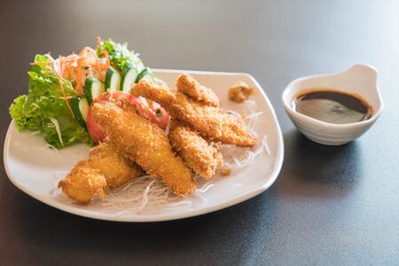 fried fish with tonkatsu sauce - japanese food styleの写真素材