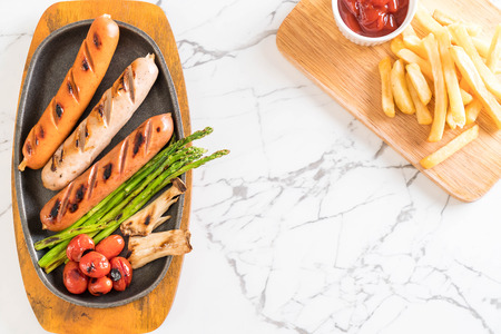 grilled sausage with vegetable on plateの写真素材