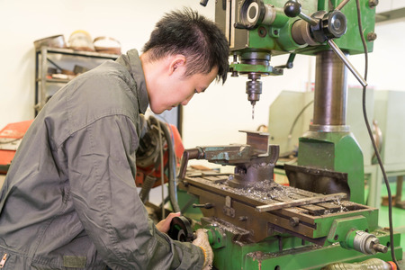Electrical engineer working with a robot machine