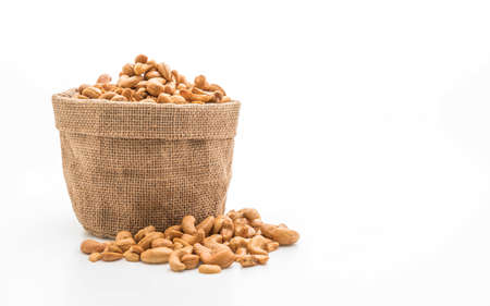 Roasted cashew nuts isolated on white backgroundの写真素材