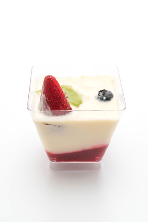 panna cotta with strawberry sauce isolated on white backgroundの写真素材