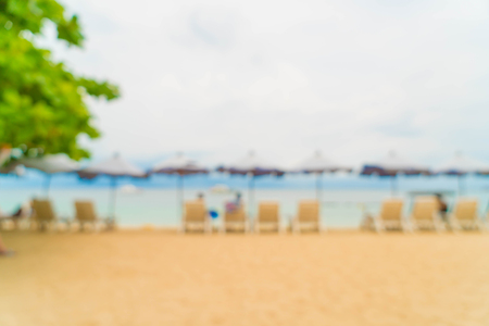abstract blur beautiful luxury umbrella and chair on sea and beach for backgroundの写真素材