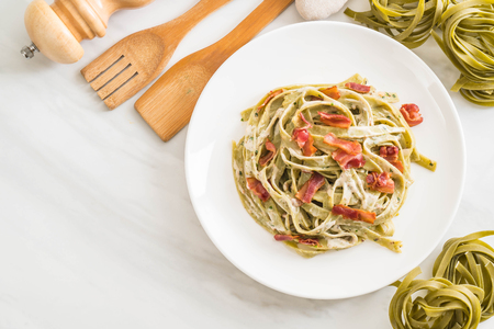 spinach fettuccini pasta with bacon - Italian food styleの写真素材